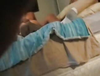 A hot brunette gets warm sperm on her face and tits