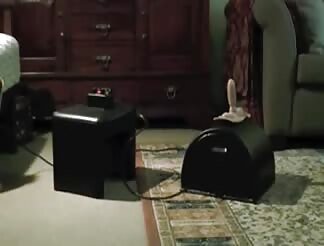 Tweaking her nips while riding a sybian