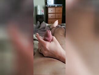 Stroking hubby’s cock