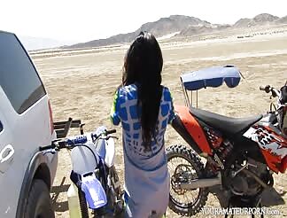 Brunette slut sucks a hard cock outdoors